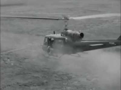 114th Aviation Company UH-1 Huey gunship in action during an air mobile seek and destroy operation in Phuoc Tuy in early 1965