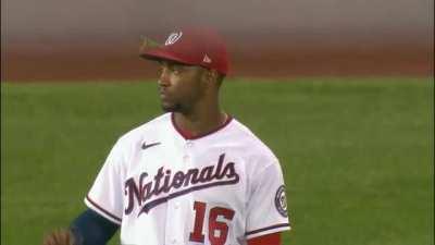 This baseball player making sure that everyone knows that there is one out... Including the praying mantis hitching a ride on his hat.