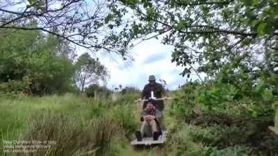 Guy builds a monorail in his garden. Steel wheels on steel track are much easier to push than a wheelbarrow.