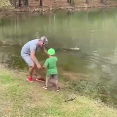 Little kid bringing in a huge fish