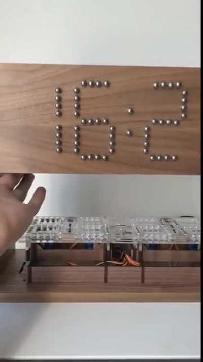 Mechanical magnetic balls clock