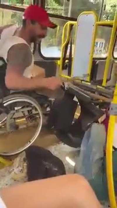 Two people in wheelchair arguing