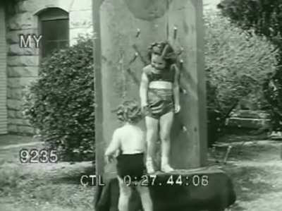 Louella Gallagher Throws knives at kids. 1950