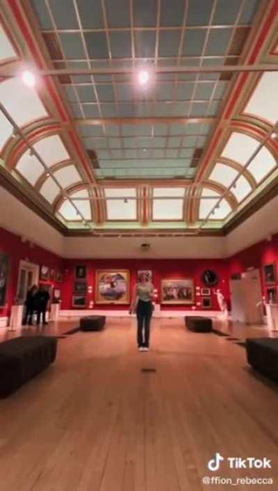 Casually belting out a song in the middle of a quite public museum