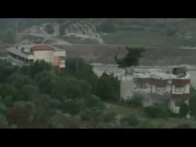 Opposition fighters target a sandbagged building being used by Syrian Army forces with PKM fire - Marj Al-Zawiya - June 2012