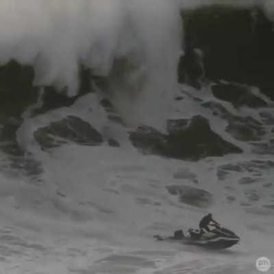 Jet ski driver saves a guy from a big wave