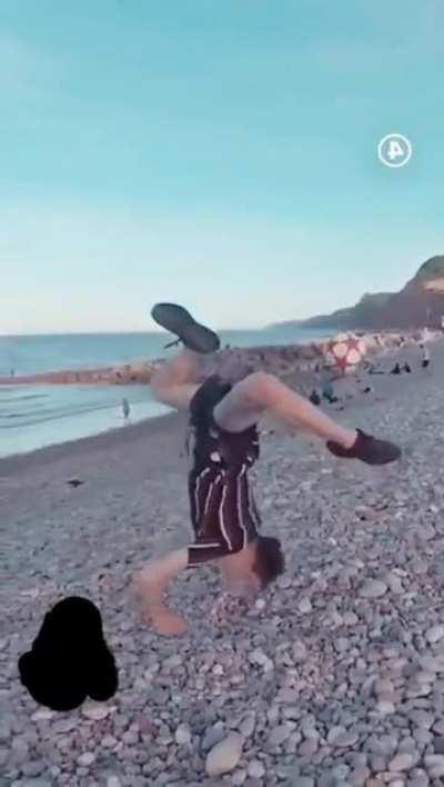 (WCGW) Doing a backflip kick on a rocky beach 