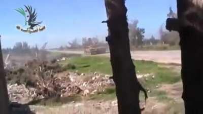 FSA rebel throws a grenade down a barrel of an SAA tank. Year unknown