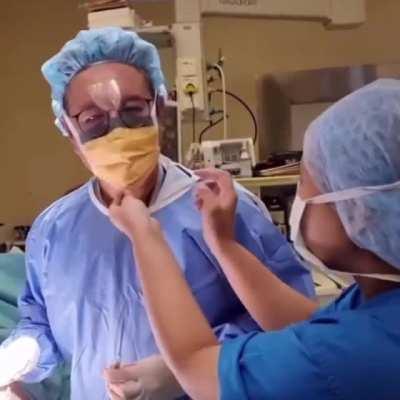 A surgeon breaks his fast while operating