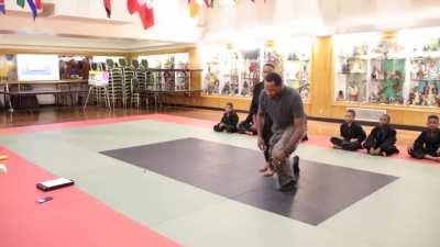 Martial arts instructor teaches young student mental fortitude &amp;amp; how to break through emotional barriers during training