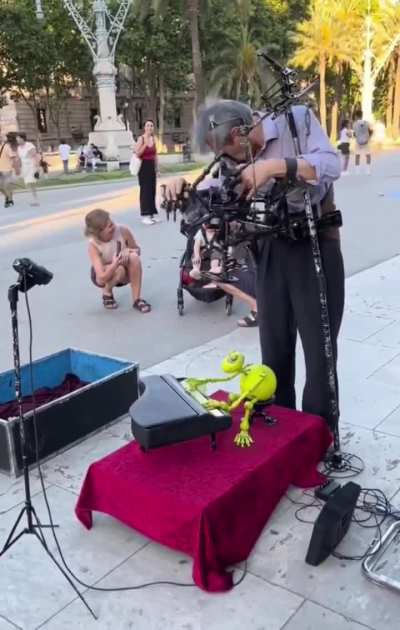 Playing the piano with his puppet