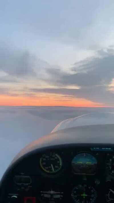 Breaking a smooth cloud cover during sunset