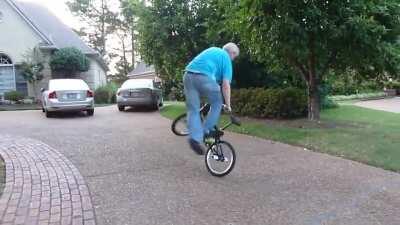 Grandpa still got it and able to do some neat tricks riding on a bmx