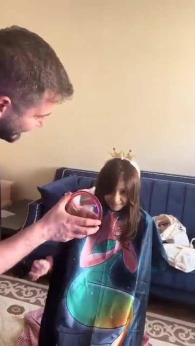 Young girl fighting cancer, who's lost all her hair, is fitted with a new wig…