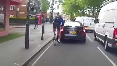 Watch cyclist fly into road rage after he crashed into car