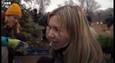 Ukrainian men and women making Molotov cocktail to help defend against the Russian soldiers