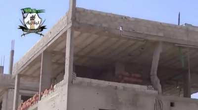 FSA engineers use a trebuchet to launch a pair of anti-tank mines at Syrian Army positions - Daraa al-Manshiya - 5/21/2014