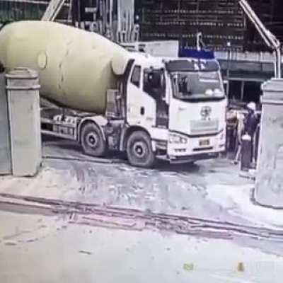 Backing up a cement truck at a construction site