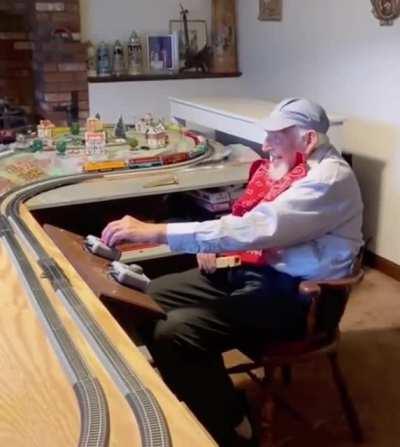 grandfather showing off his super cool trains