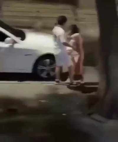 Dude let's woman slap him twice but knocks her out when she touches his car.