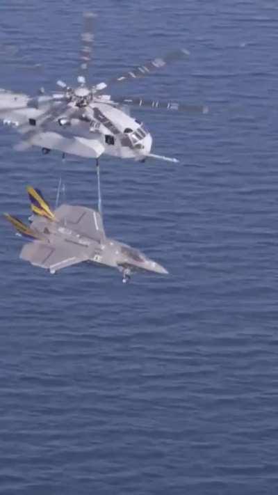 USMC Sikorsky CH-53K Sea Stallion shows its capability during an external load lift certification transporting a F-35C airframe.