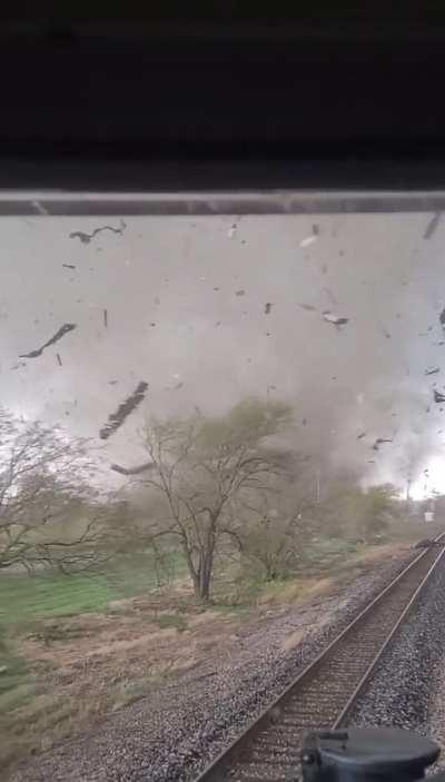 Train conductor and engineer survive a direct hit from a tornado