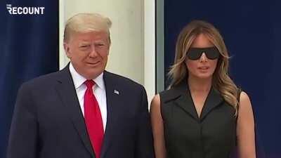 Trump asks Melania to smile during today's photo op.