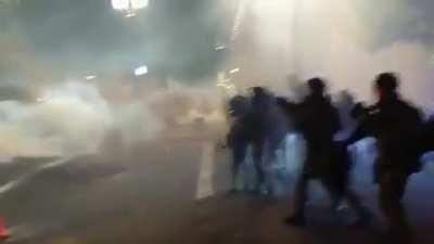 A scene straight out of a dystopian movie from the Portland protests. Federal officers advance as they shoot at and gas protestors.