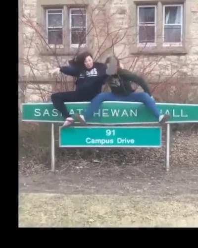 To take a picture while sitting on a sign...