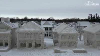 Row of Lakefront Houses in Ontario, Canada Frozen Over due to Waves from Winter Storm