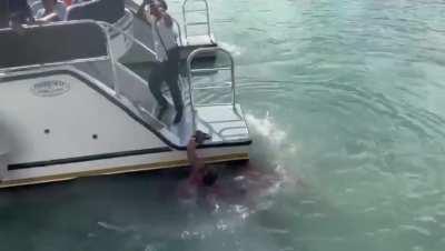 Drunken man jumps off boat after being warned not to and takes a propeller to the leg