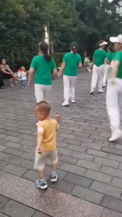 This Toddler dancing with the group