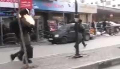 Israeli soldier getting a molotov cocktail thrown at by Palestinian terrorist.