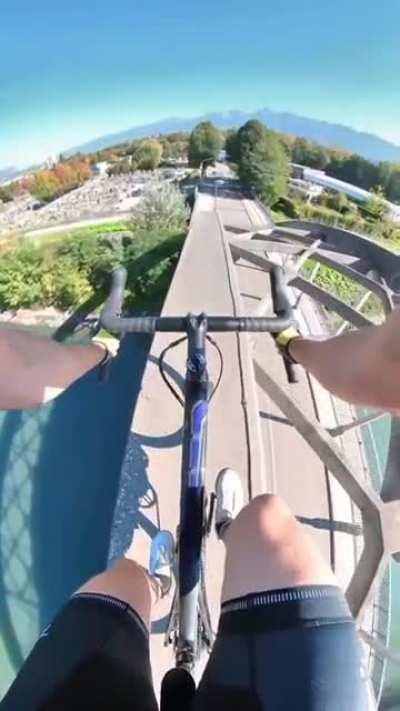 French cyclist goes over a bridge ... Successfully