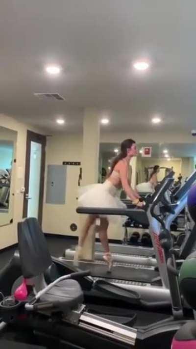 Girl Practices Ballet in the Gym.