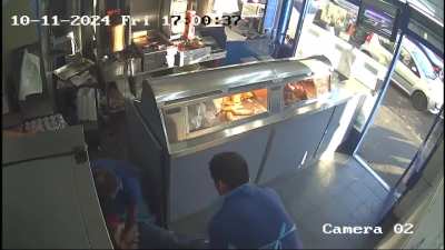 Watch as knife-wielding fish and chip robber gets battered by hero staff