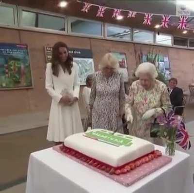 Queen Elizabeth II insisted on cutting a cake using a ceremonial Sword at an event on the sidelines of the G7 Summit