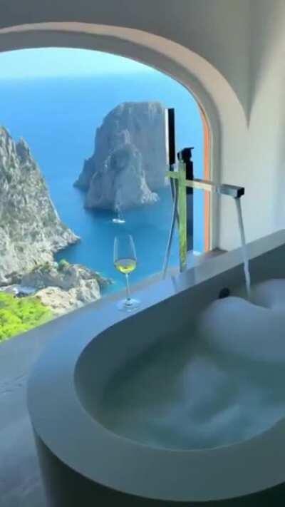 A bathroom with a beautiful view in Capri, Italy