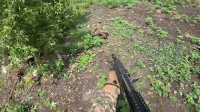 Ukranian soldier tries to help a russian wounded soldier only to find out he was holding a grenade.