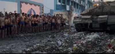 Hamas members laying down their weapons and surrendering to the IDF in Gaza