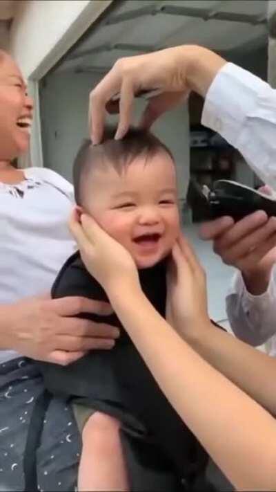 This baby getting a haircut.