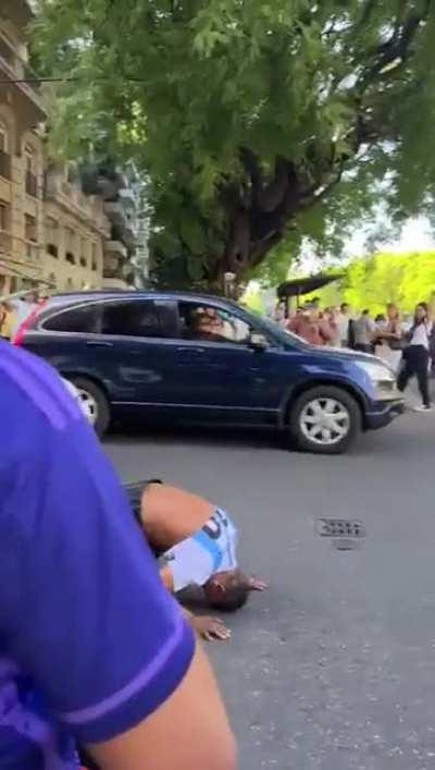 Homeless man in Argentina is overjoyed when other soccer fans give him a soccer shirt so he can celebrate Argentia's world cup victory