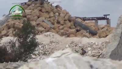 Opposition infiltration team sneaks an improvised explosive to the base on a sandbagged government firing position - Al-Mayasat Hill, Aleppo - 2015