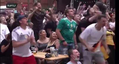 German fans celebrating Müller's miss