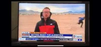 Guy Naruto Runs Past News Anchor for Storm Area 51