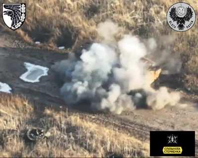 Russian soldier tries to hide under a destroyed APC then a Ukrainian FPV drone hit him