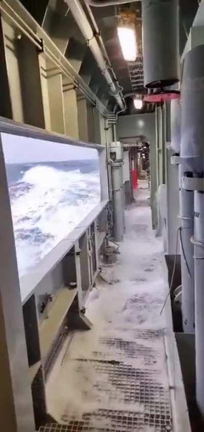 Navy ship cruising through a ocean