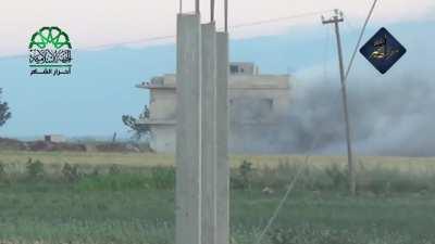 Opposition using a captured T-55 to punch holes in a Syrian Army controlled building - Jisr al-Shughur - 5/16/2015