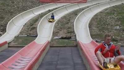 Grandpa coming in hot on an alpine slide