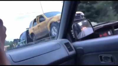 Guy takes his truck back off of a moving tow truck